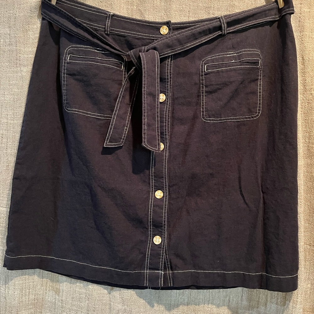 Super lightweight denim colored button-up skirt.